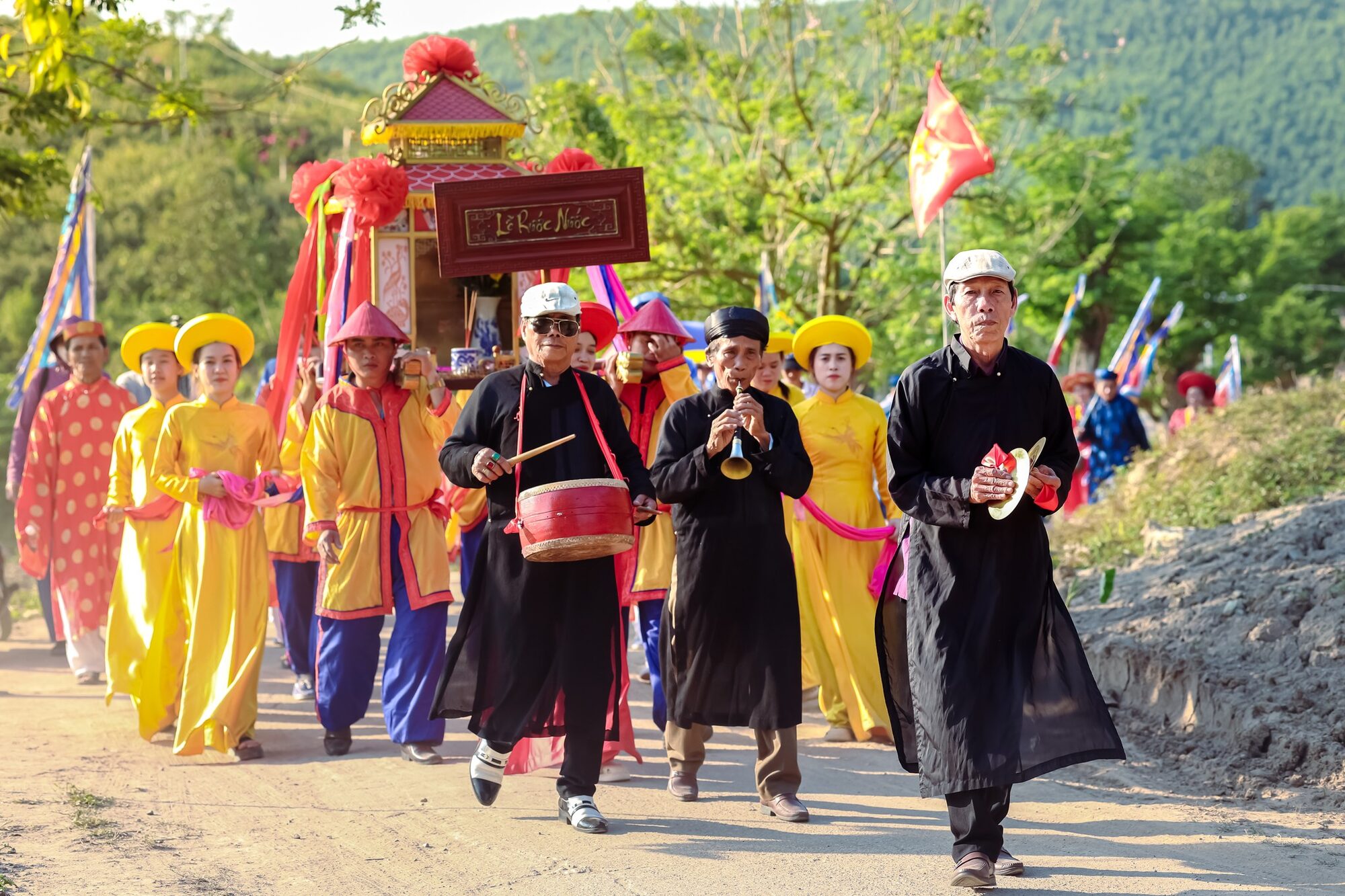 Traditional water procession through the village